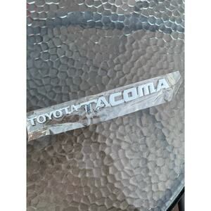 Toyota Tacoma Silver Chrome Plastic Emblem Sticker, new.